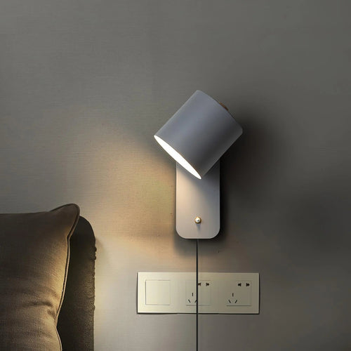 Luminária de parede cilíndrica em acabamento mate, projetada para iluminar com elegância e simplicidade em ambientes contemporâneos.