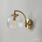Arandela de Parede em Metal Dourado com Detalhes em Vidro Transparente