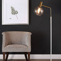 Luminária de mesa em estilo nórdico minimalista com cúpula de vidro e base de mármore para uma luz elegante.