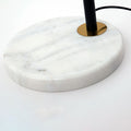 Luminária de mesa em estilo nórdico minimalista com cúpula de vidro e base de mármore para uma luz elegante.