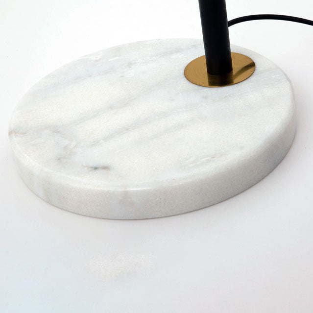 Luminária de mesa em estilo nórdico minimalista com cúpula de vidro e base de mármore para uma luz elegante.