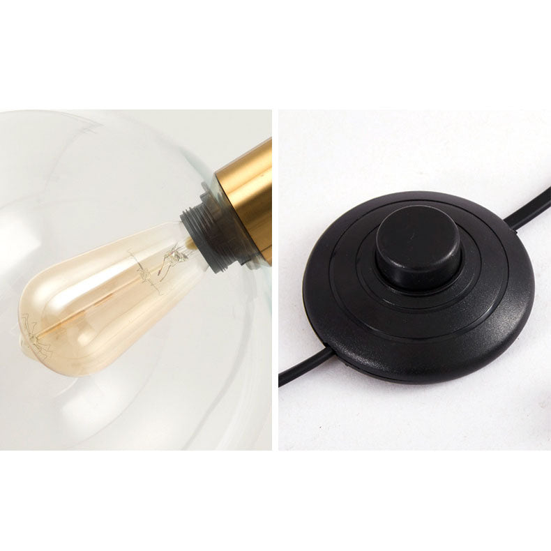 Luminária de mesa em estilo nórdico minimalista com cúpula de vidro e base de mármore para uma luz elegante.