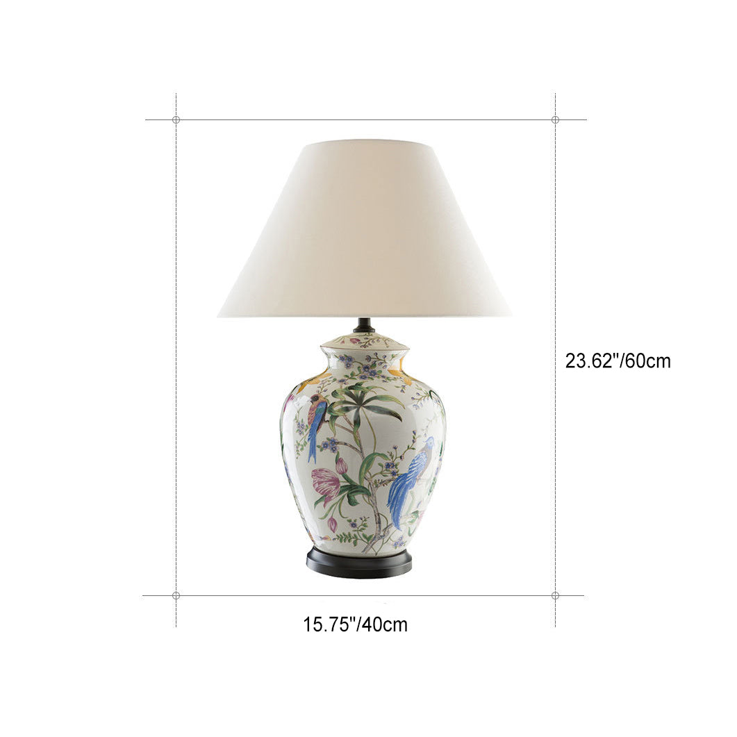 Luminária de mesa estilo retrô em cerâmica com design de flores e pássaros.