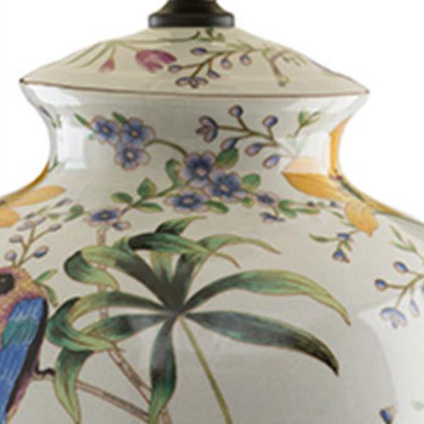 Luminária de mesa estilo retrô em cerâmica com design de flores e pássaros.