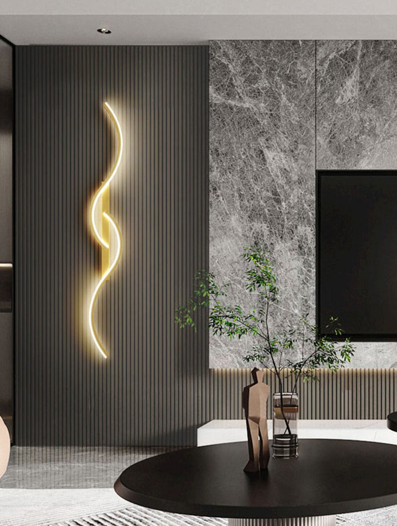 Luminária de parede LED contemporânea com design artístico envolvente e iluminação suave que transforma ambientes. Dourado