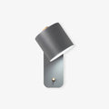 Luminária de parede cilíndrica em acabamento mate, projetada para iluminar com elegância e simplicidade em ambientes contemporâneos. Cinza