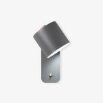 Luminária de parede cilíndrica em acabamento mate, projetada para iluminar com elegância e simplicidade em ambientes contemporâneos. Cinza