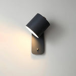 Luminária de parede cilíndrica em acabamento mate, projetada para iluminar com elegância e simplicidade em ambientes contemporâneos. Preto