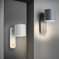 Luminária de parede cilíndrica em acabamento mate, projetada para iluminar com elegância e simplicidade em ambientes contemporâneos.