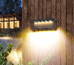 Luminária de parede elegante com iluminação LED ambiente e acabamento resistente em aço inoxidável para exteriores.
