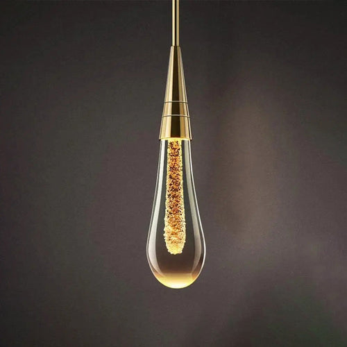 Luminária de parede em LED com design escultural em forma de gota d'água, oferecendo uma iluminação suave e envolvente.