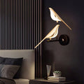 Luminária de parede em LED contemporânea com design elegante em formato de pássaro, perfeita para criar um ambiente acolhedor e sofisticado.