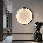 Luminária de parede em anel esculpido, com iluminação suave e design curvilíneo contemporâneo. Preto