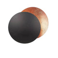 Luminária de parede em formato de eclipse solar com iluminação suave e design contemporâneo que transforma ambientes. Cobre Preto
