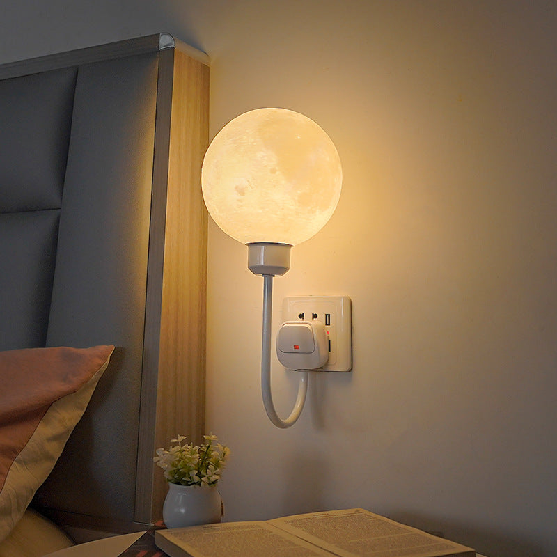 Luminária de parede em formato lunar com brilho suave e design contemporâneo para uma iluminação acolhedora.
