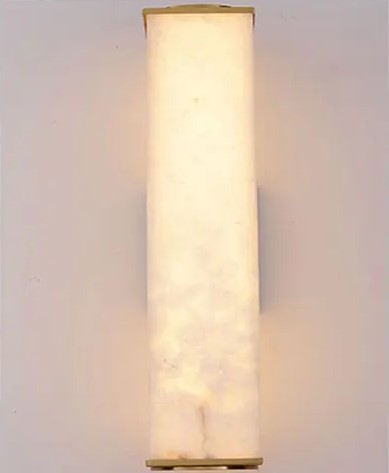 Luminária de parede em pedra refinada com iluminação suave e design escultórico contemporâneo.