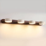 Luminária de parede em travertino refinado, com iluminação suave e design contemporâneo para ambientes sofisticados. 4-Luzes Cor Noz