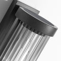 Luminária externa cilíndrica de metal e vidro, resistente à água IP65 com design moderno.