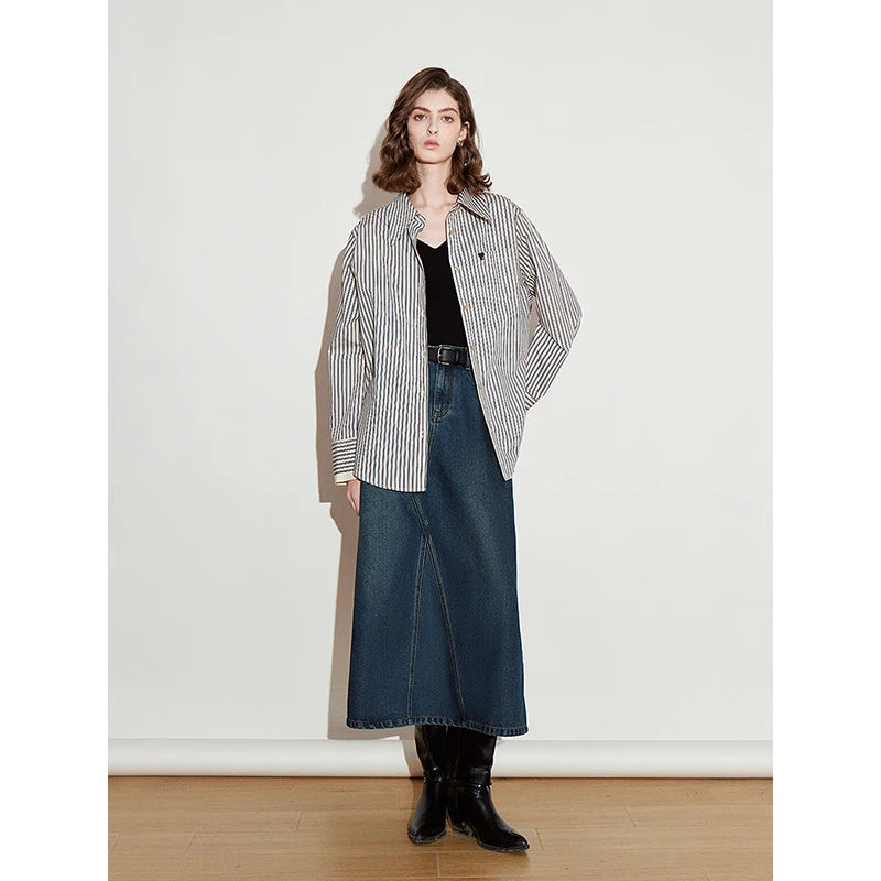 Saia Jeans Midi Feminina com Bolsos Evasê de Liocel